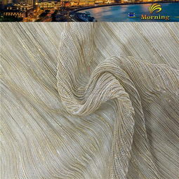 舞臺魅力與禮服華彩 全滌針織幻燈絲壓皺亮絲網(wǎng)布的時尚之旅